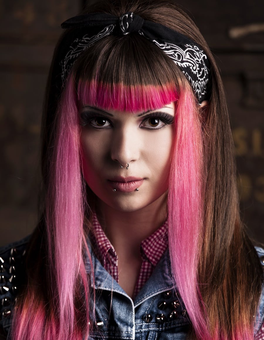 pink skunk stripe hairstyle with bangs