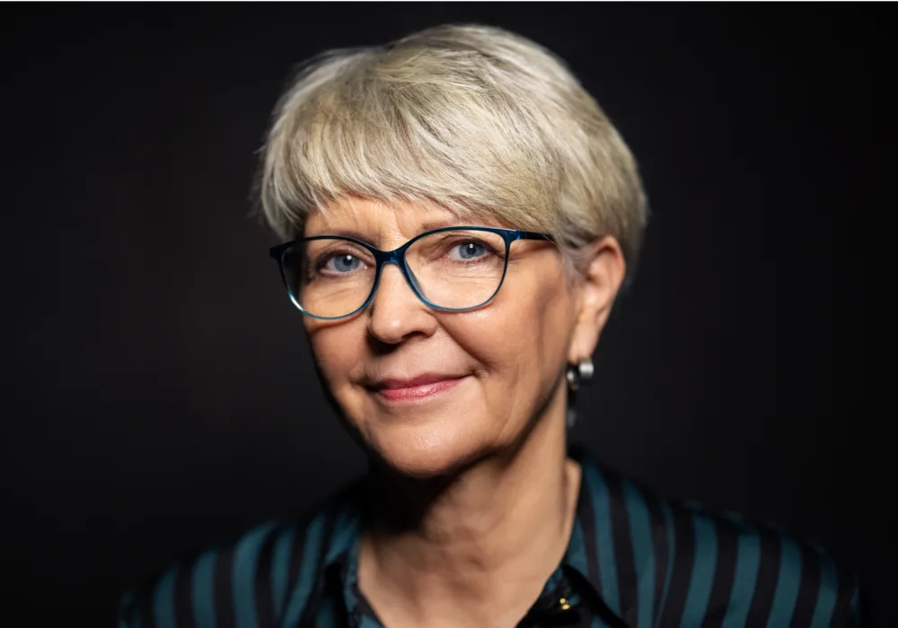 Pixie cut with bangs for older women with glasses