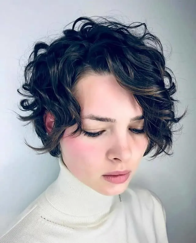 curly pixie with brown highlights