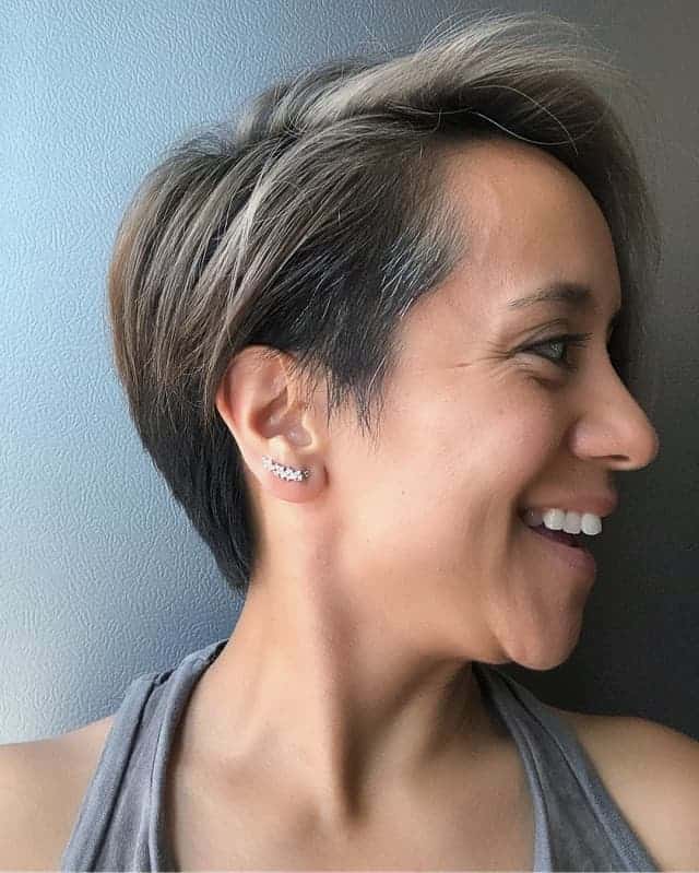 side parted pixie cut with highlights