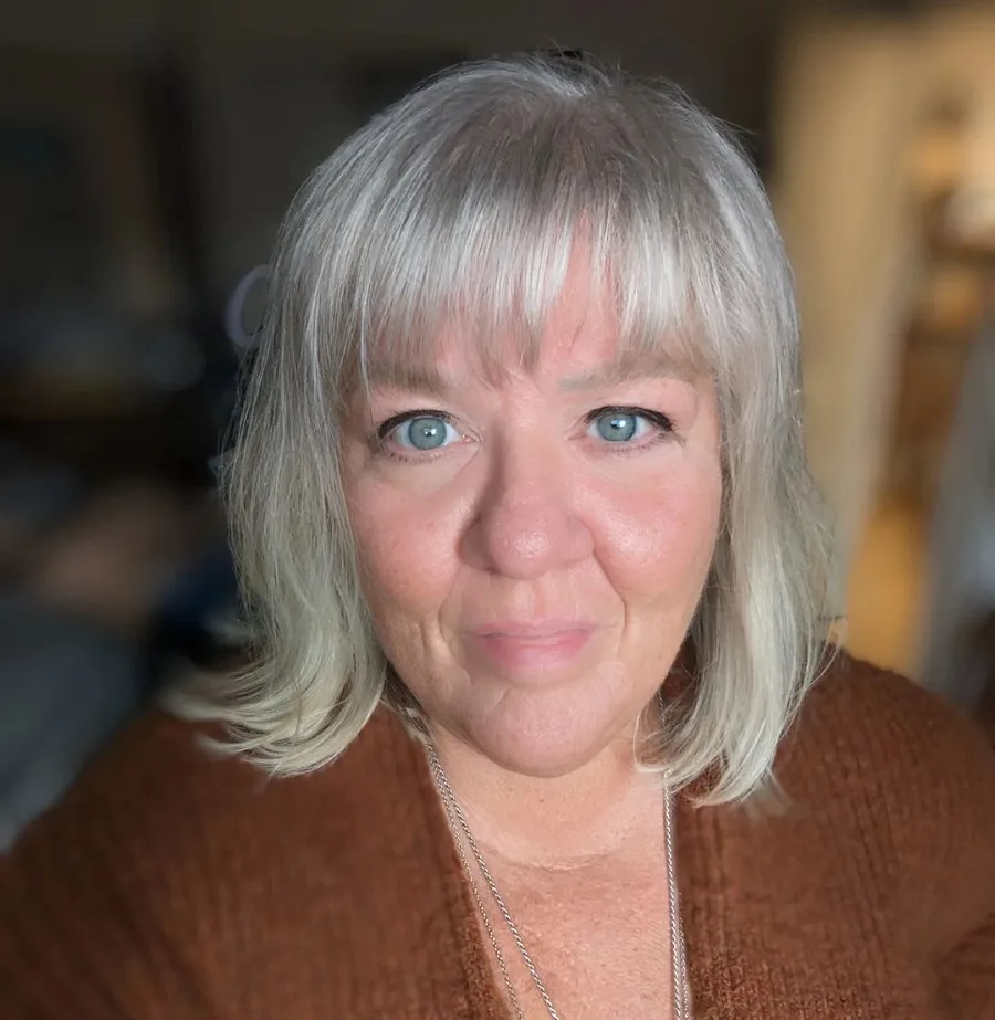 platinum hairstyle with bangs for over 50