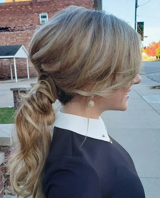 messy ponytail with bangs