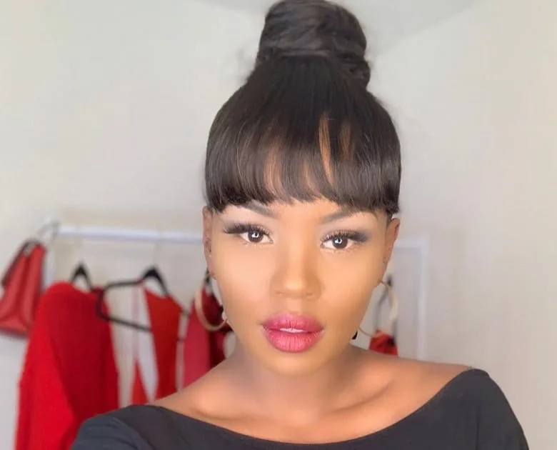 high bun hairstyles with bangs for black women