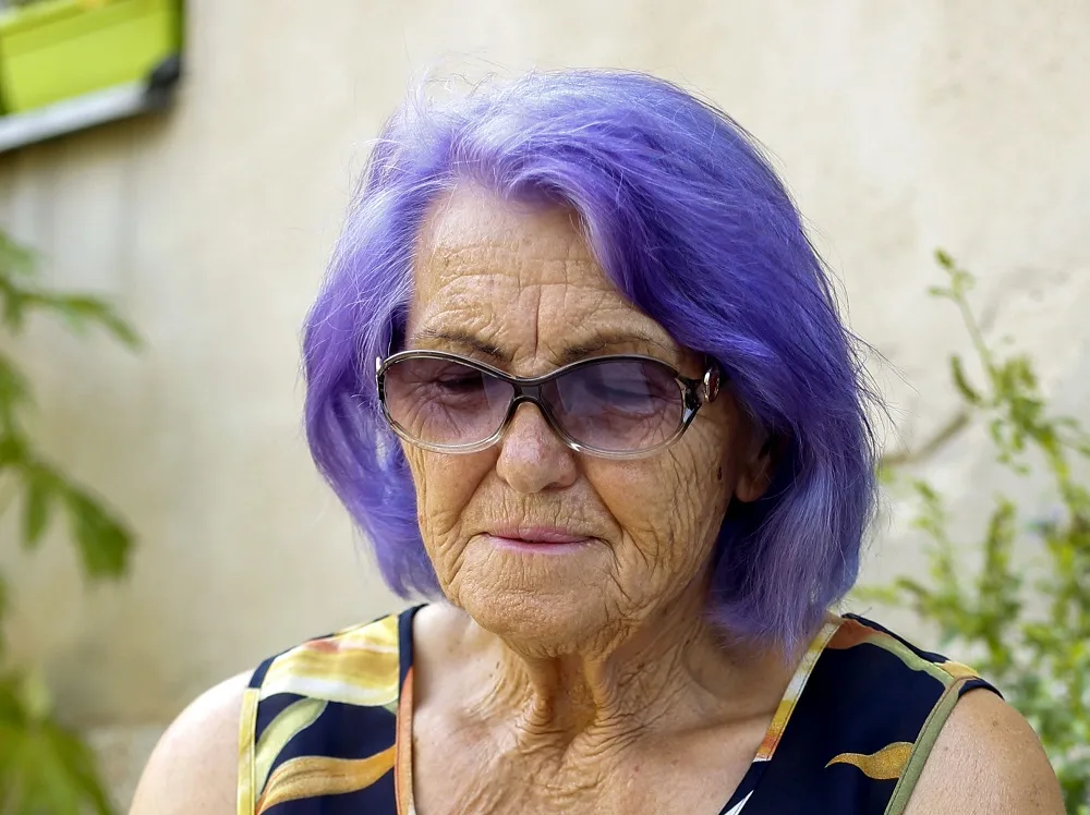 purple bob for over 60 women with glasses