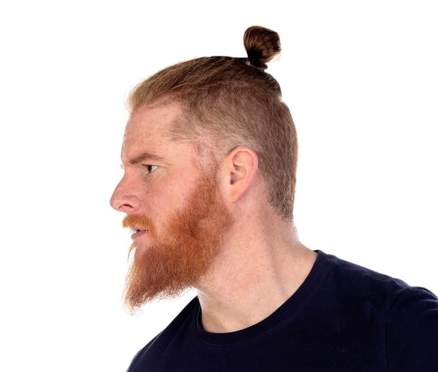 red haired man bun with undercut