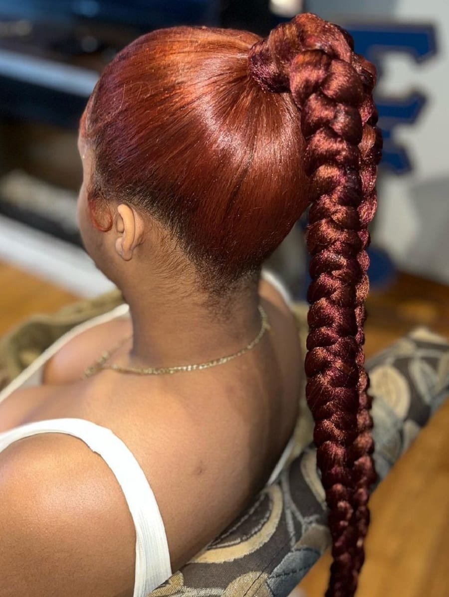 red slicked back ponytail braid