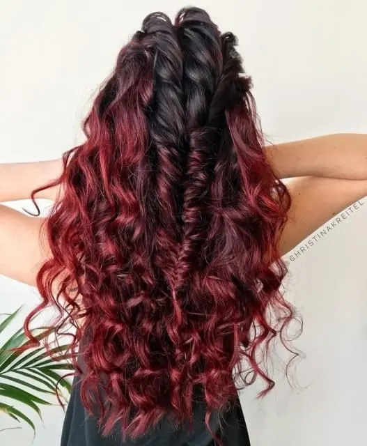 women with red wine curly hair