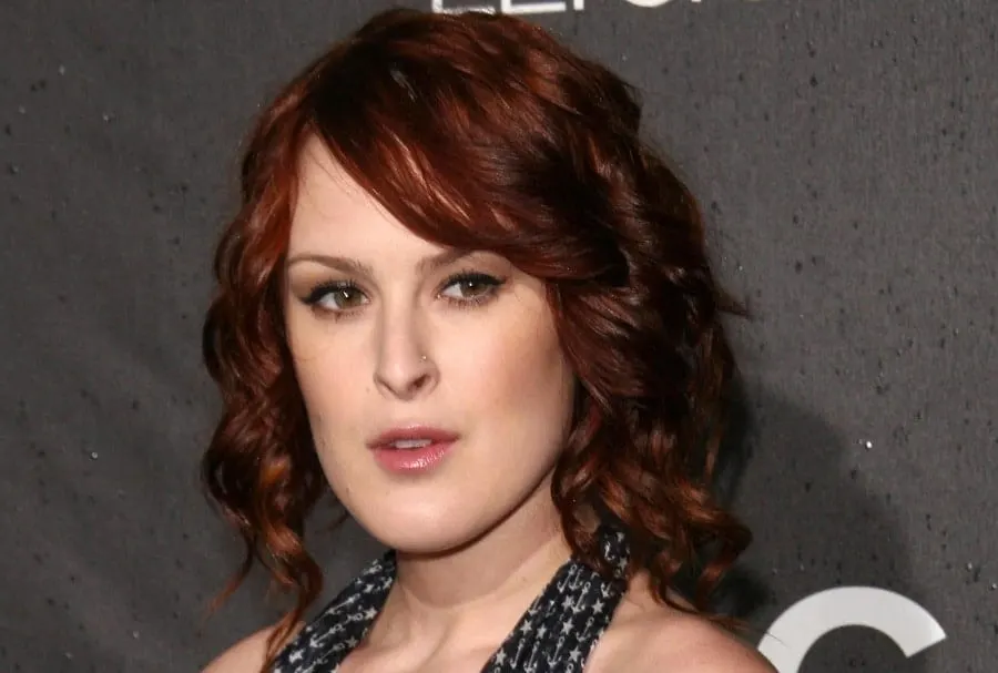 redhead celebrity Rumer Willis with dark auburn curly hair