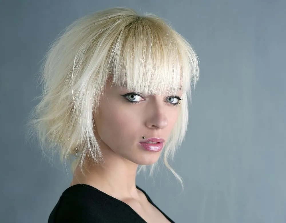 Image of Shaggy updo hairstyle for thick straight hair