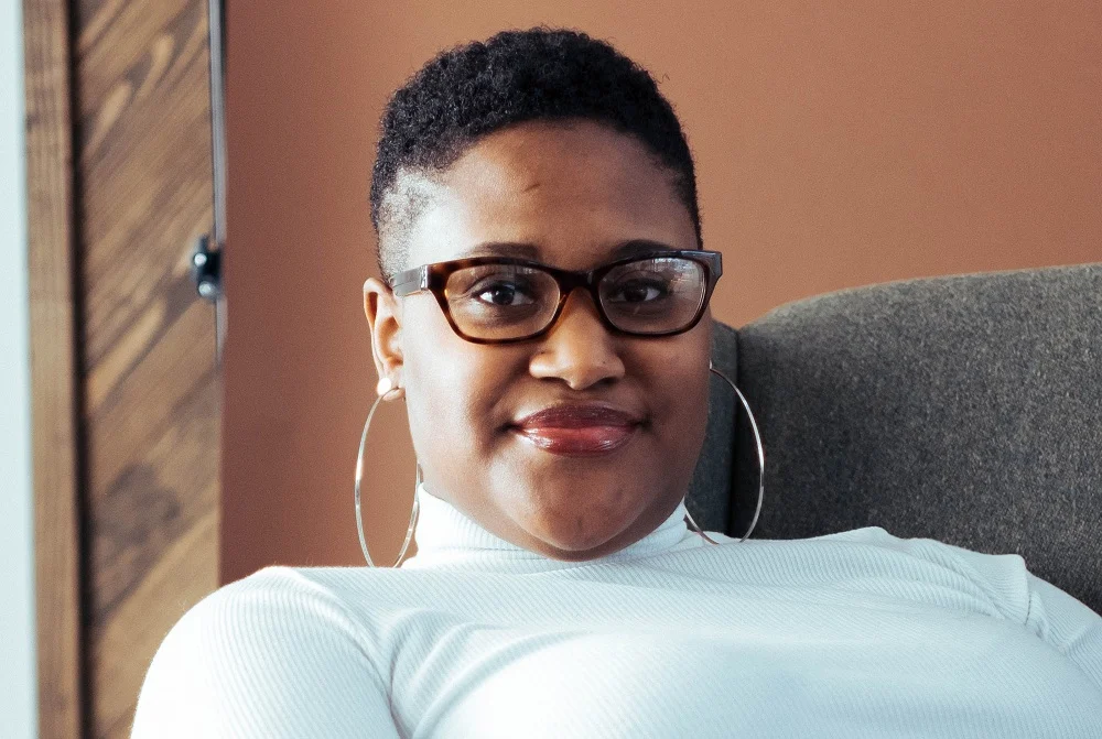 shaved hairstyle for black women with glasses