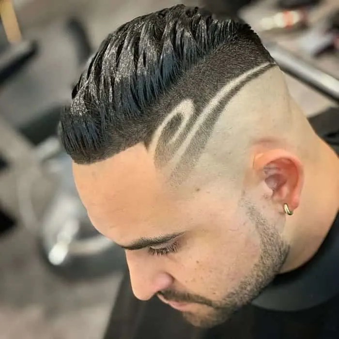 shaved sides hairstyle with pattern for men