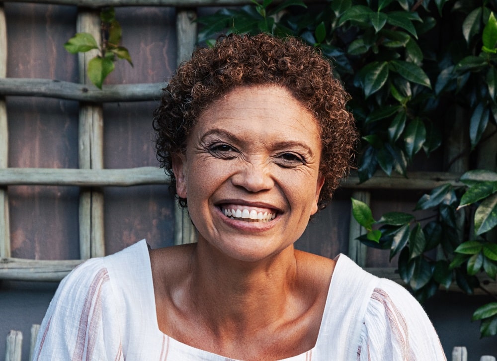 short Afro hairstyle for over 50 with round face