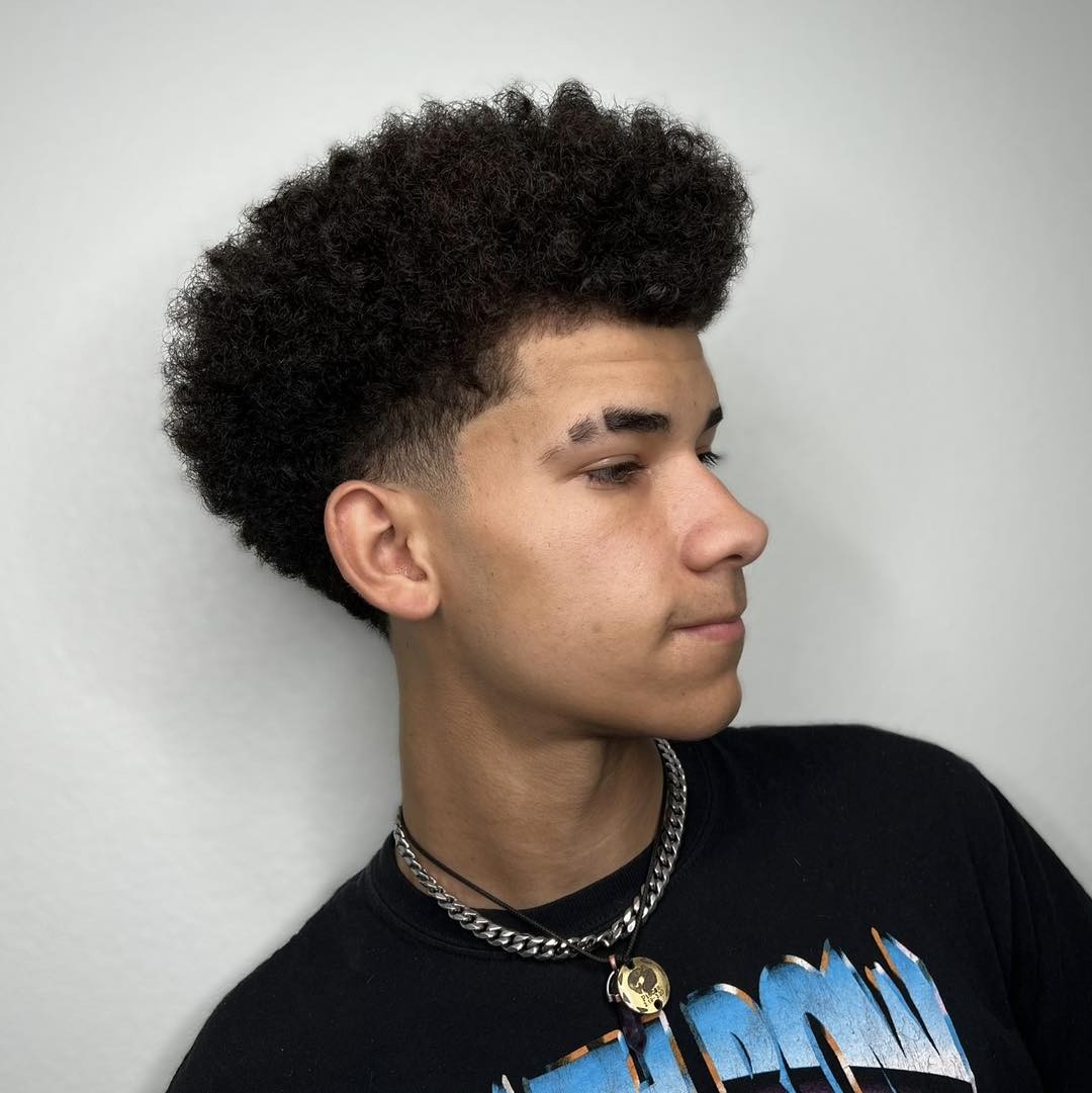 short afro hair with low taper fade