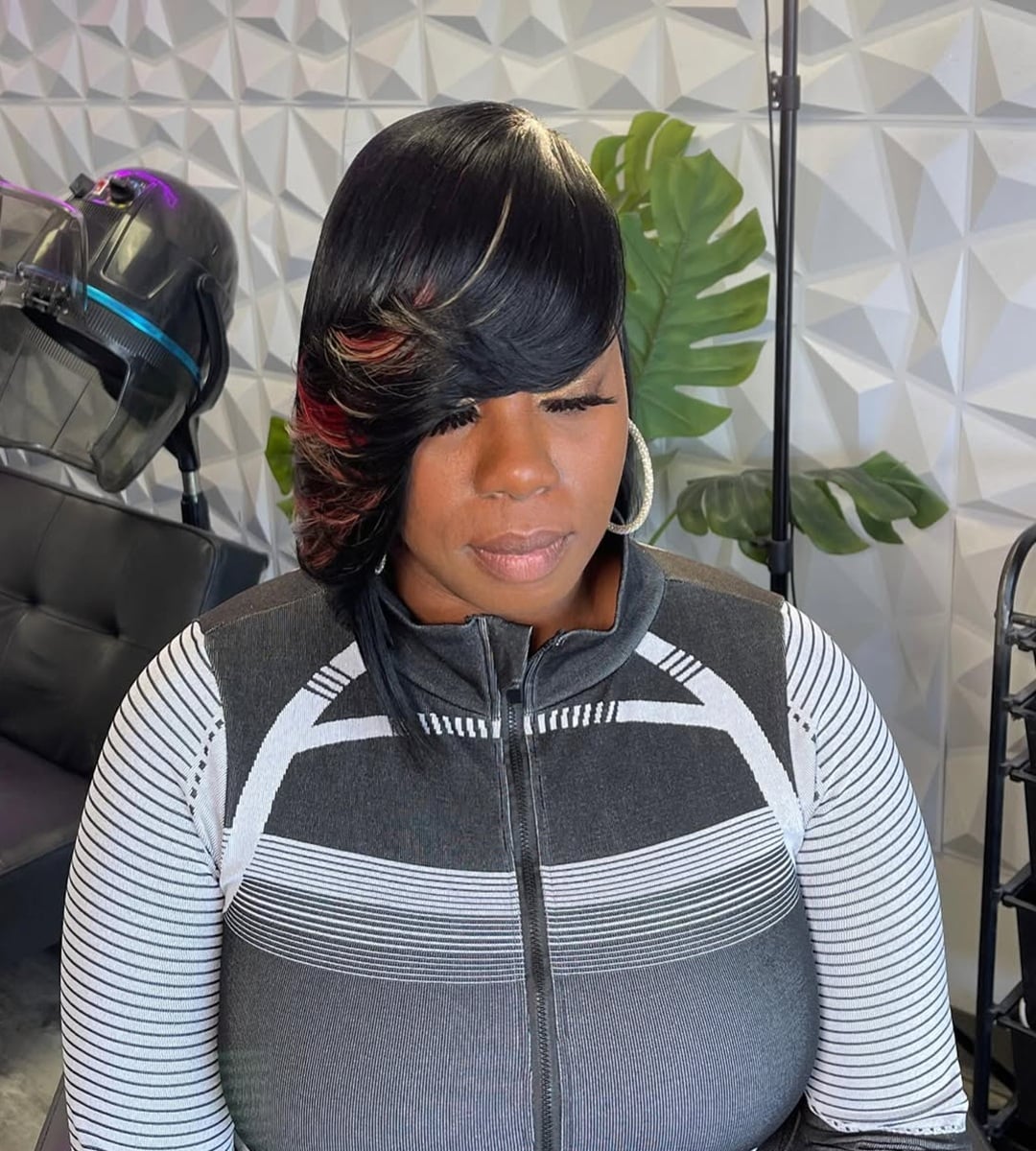 short asymmetrical black bob with side swept bangs