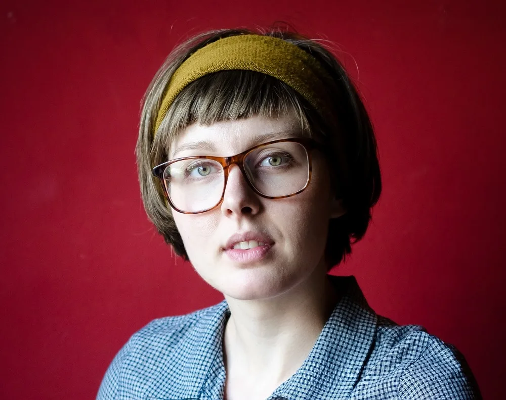 short bob for round face women with bangs and glasses