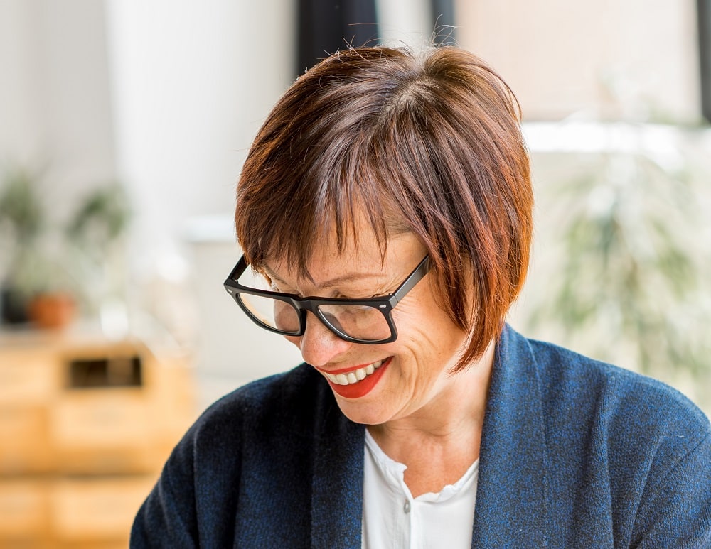 short bob hairstyle for over 50 with glasses