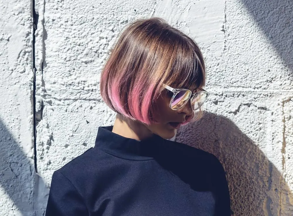 short brown hair with pink highlights