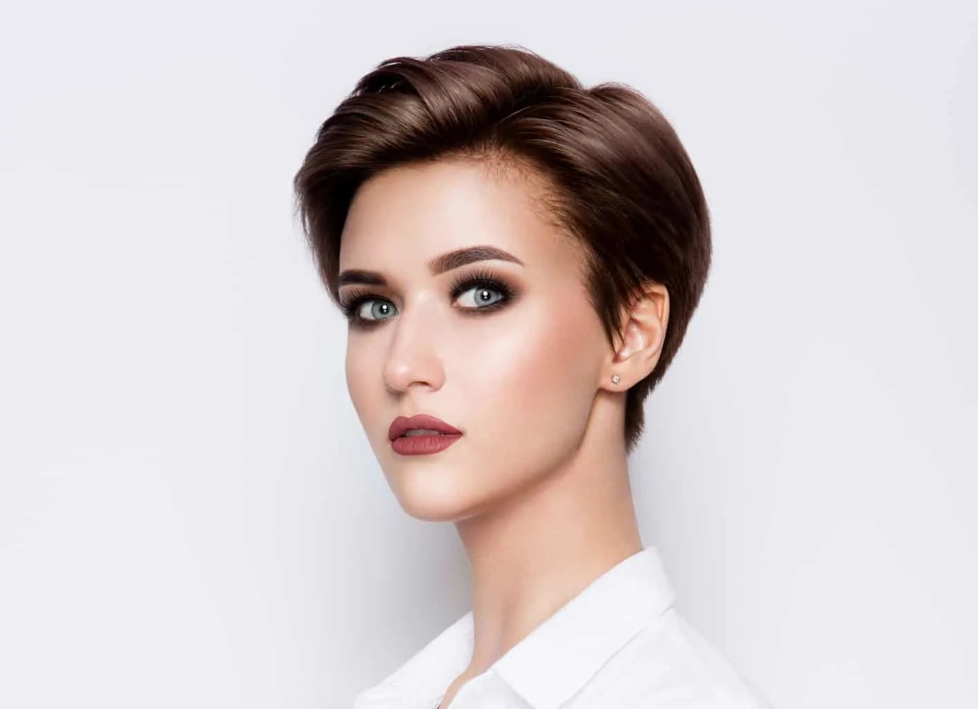 short chestnut brown pixie cut