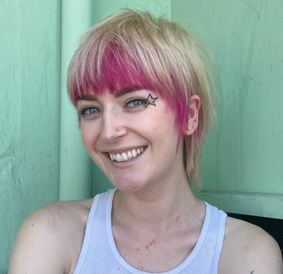 Short cropped blonde hair with pink underneath