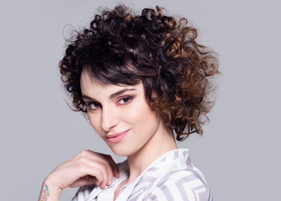 short curly brown hair with highlights