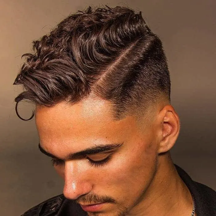 short loose curls with low fade for men