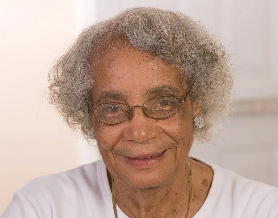 short hairstyle for black women over 70 with glasses