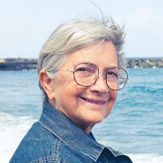short hairstyle for over 70 with glasses