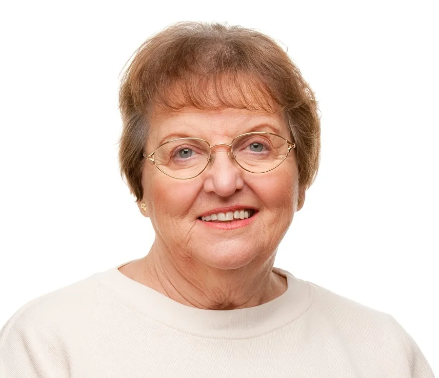 short hairstyle with bangs for over 70 with glasses