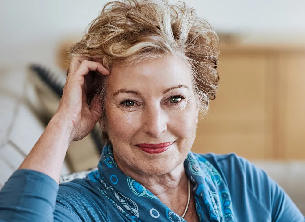A short and bold hairstyle over 50 with a round face