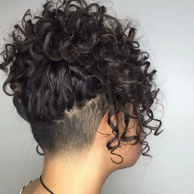 short curly layered hair with undercut 