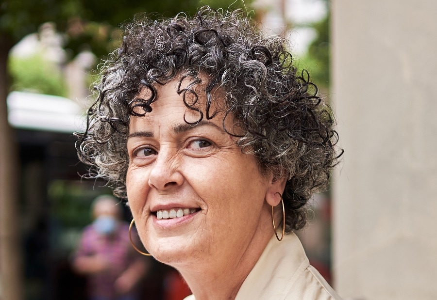 Short layered curly hairstyle for women over 60