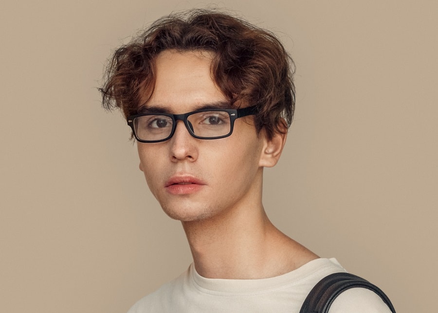 Short middle part hairstyle for men with glasses