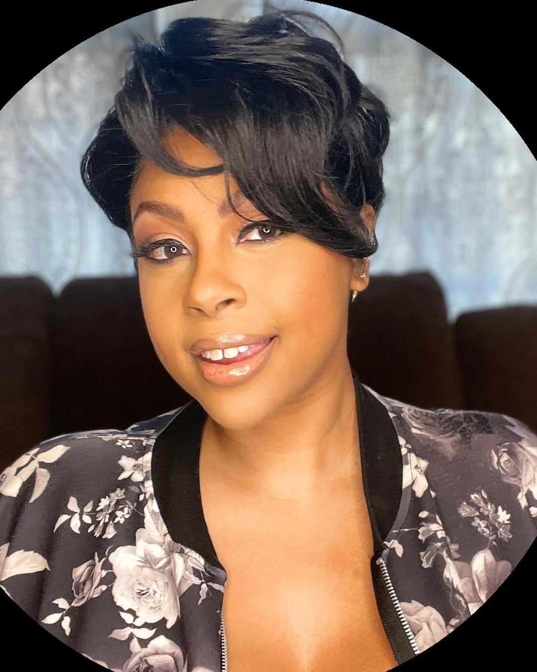 short black pixie cut with side swept asymmetrical bangs