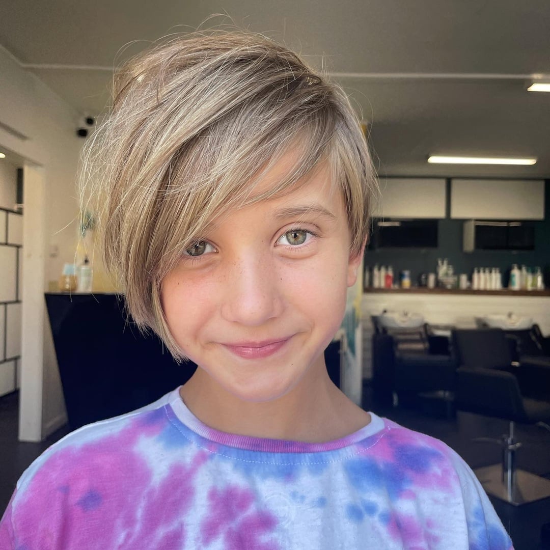blonde short pixie cut with long, sweeping side bangs for little girls