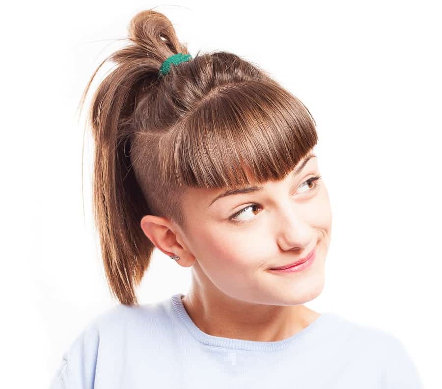 short ponytail with shaved sides