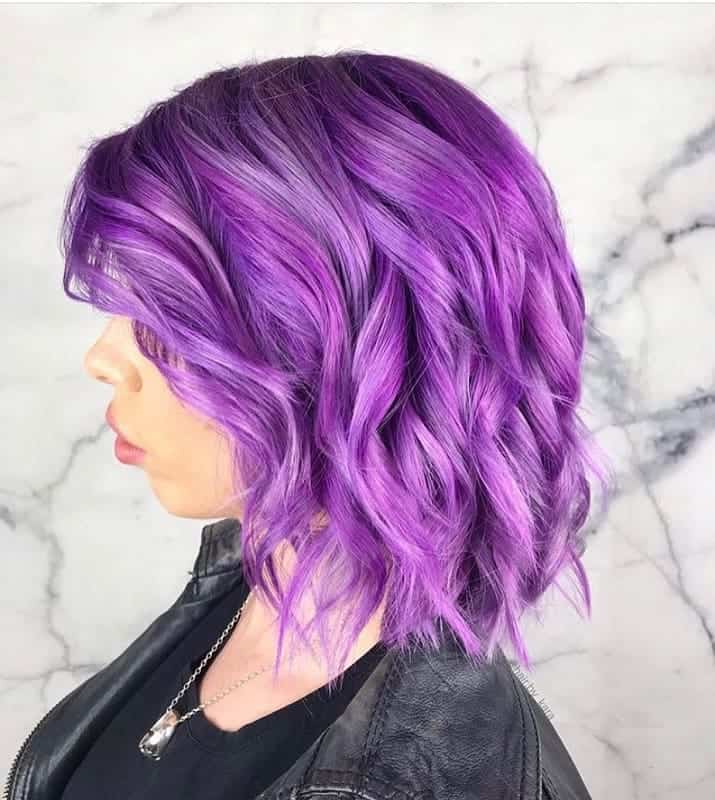 short purple bob with loose curls 