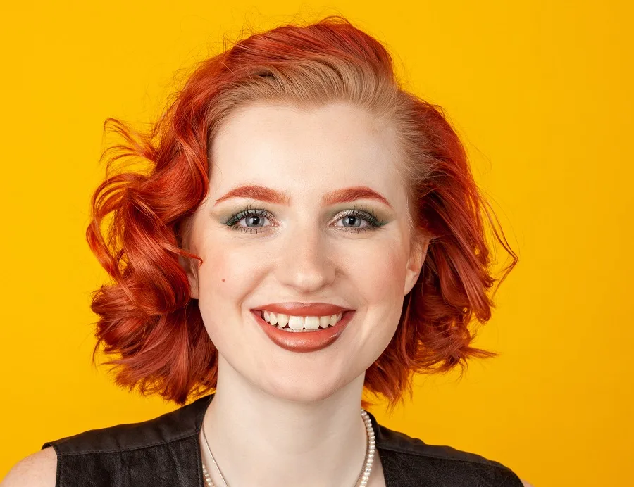 Short curly red bob for women with round faces