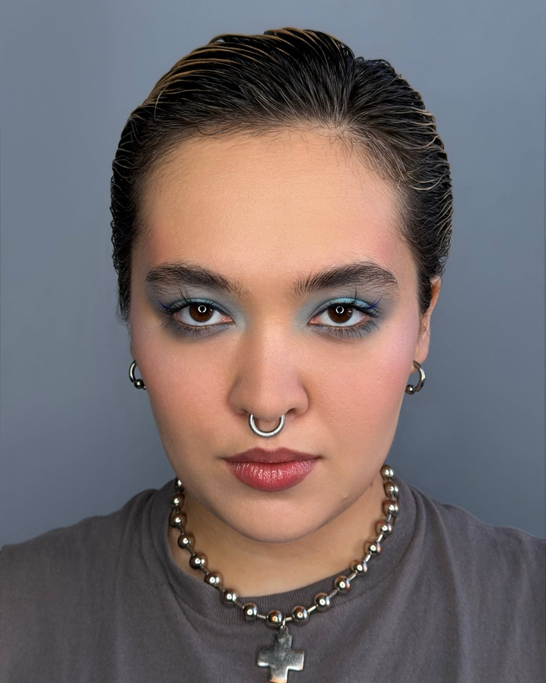 short wet look slicked-back hairstyle for women