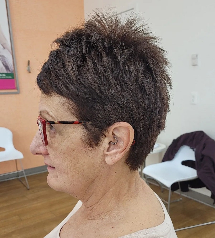 Short and spiky haircut over 70 with glasses