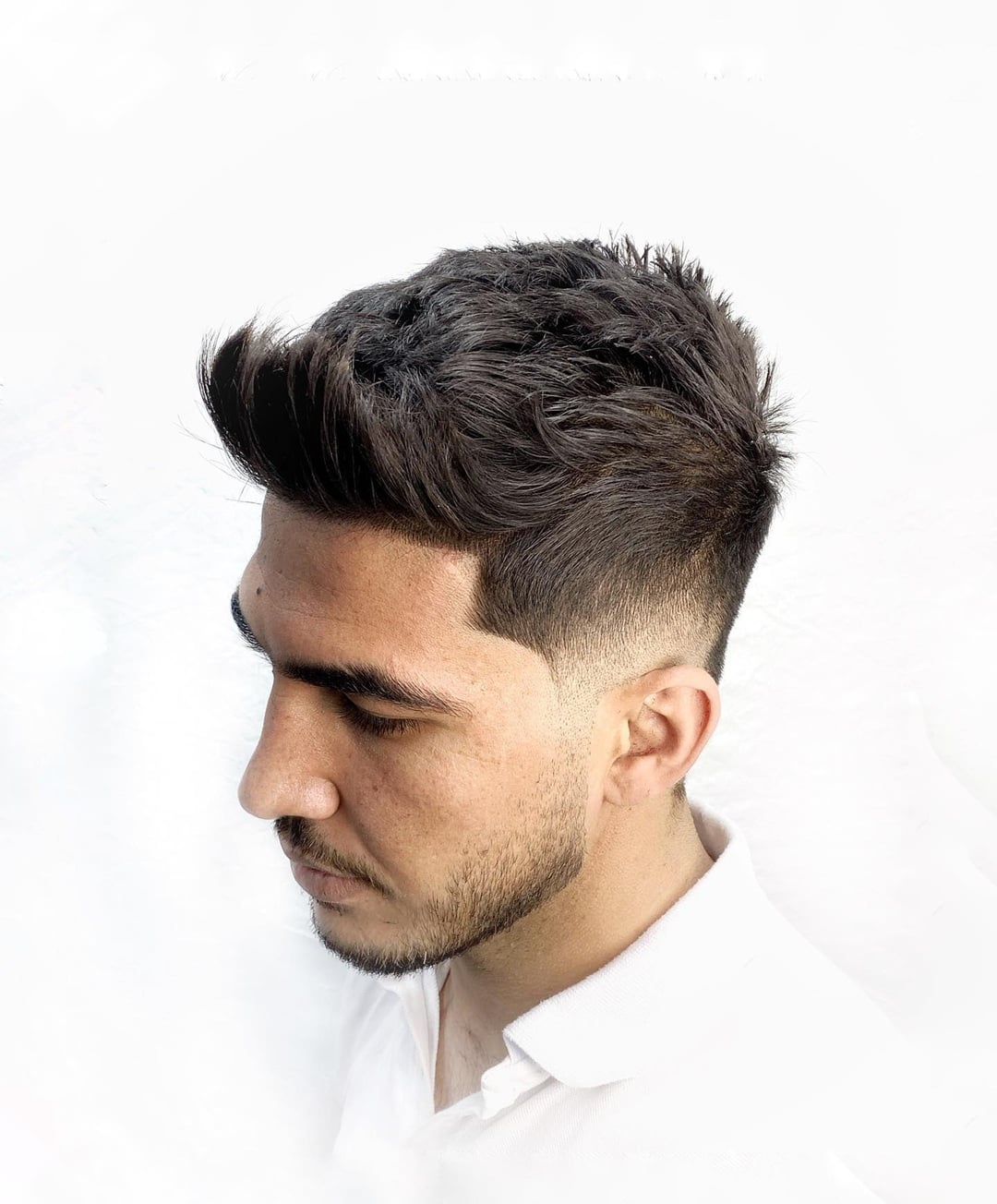short spiky textured quiff hairstyle and skin fade