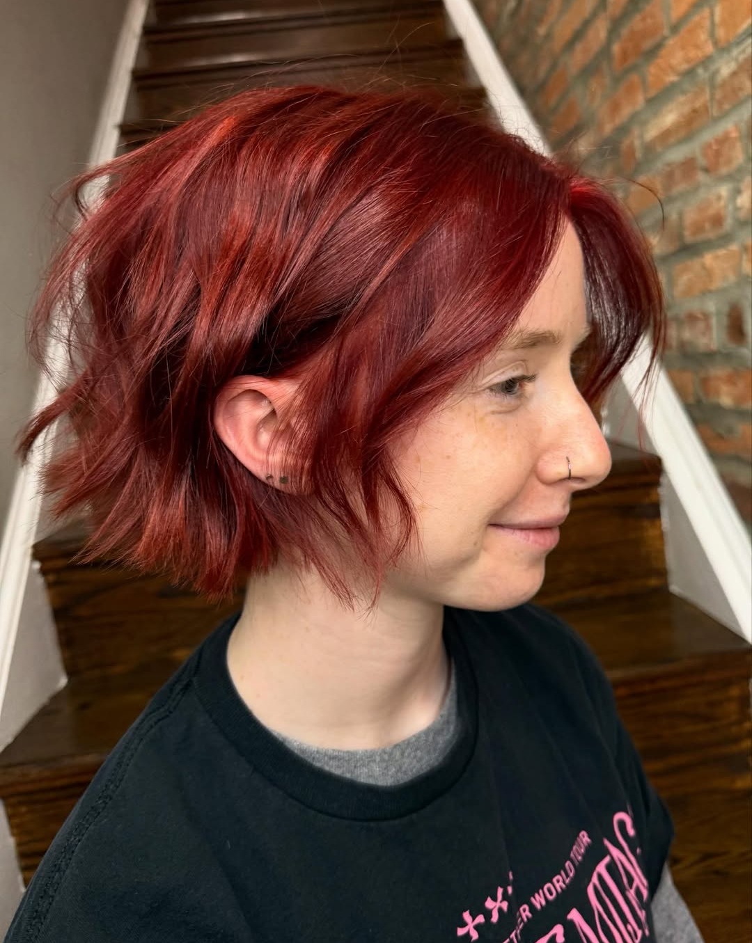 Short wavy bob with a vibrant cherry copper red hair color