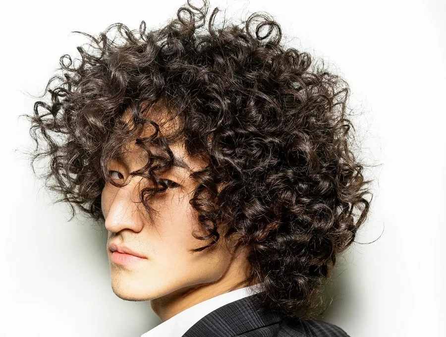 shoulder length tight perm hairstyle for men