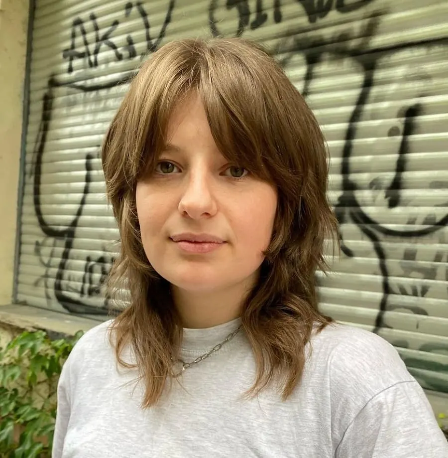 shoulder length wolf cut with curtain bangs