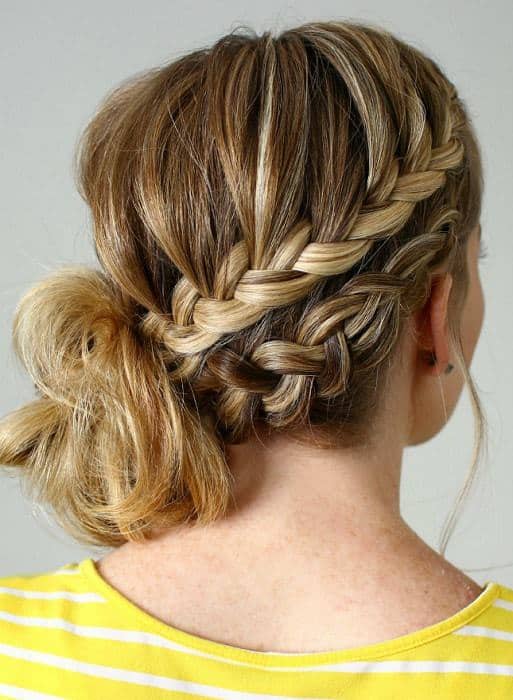 women with double braided side messy bun