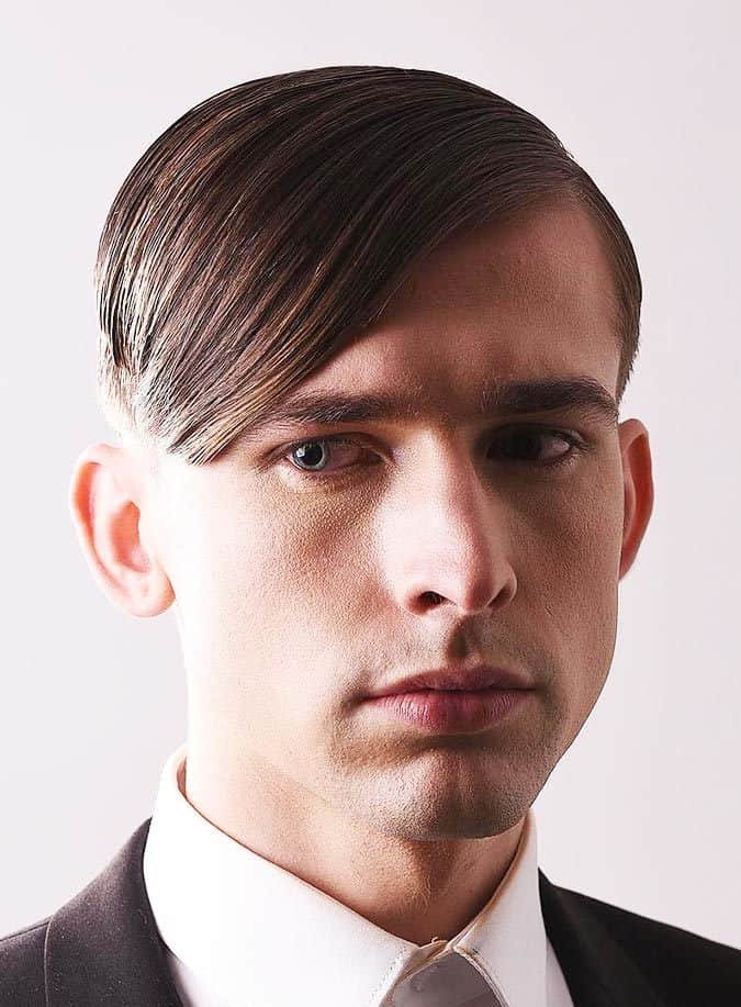 Sleek side swept straight hair combed smoothly across a receding hair line