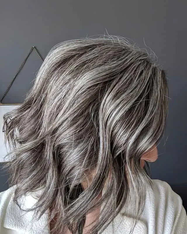 shaggy bob with silver hair highlights