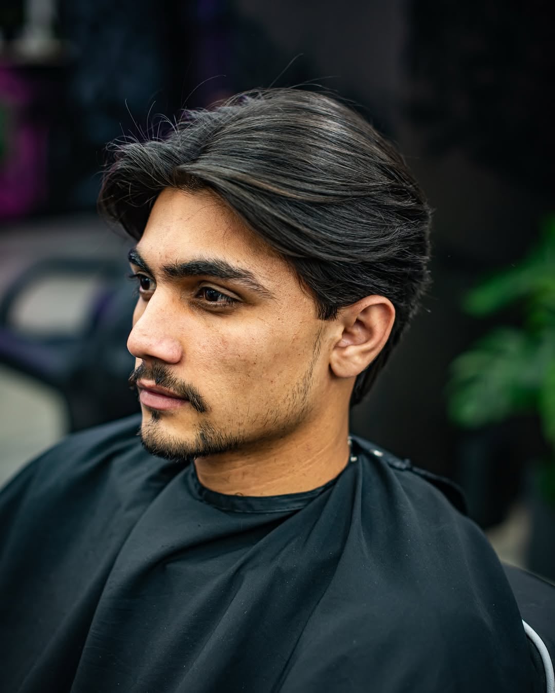 middle-parted skater haircut for straight hair
