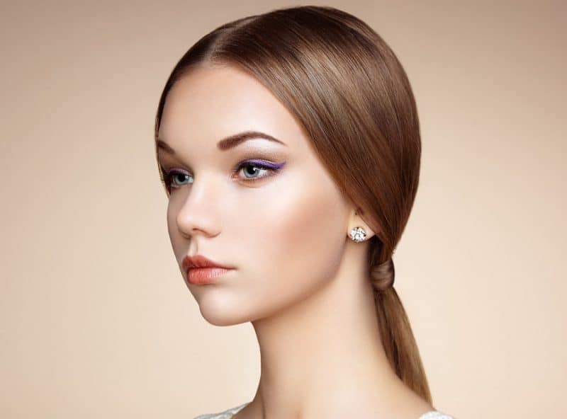 sleek middle part ponytail for women