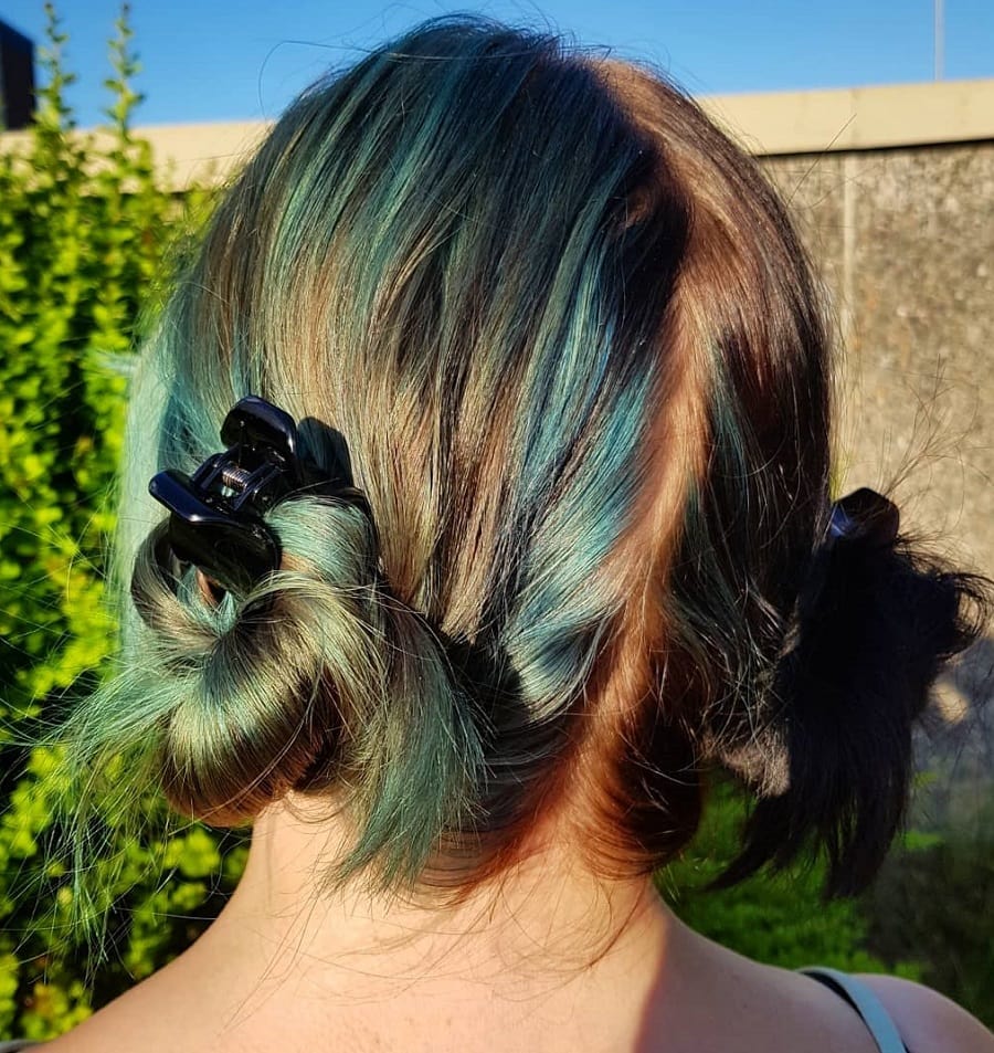 space bun hairstyle with claw clip