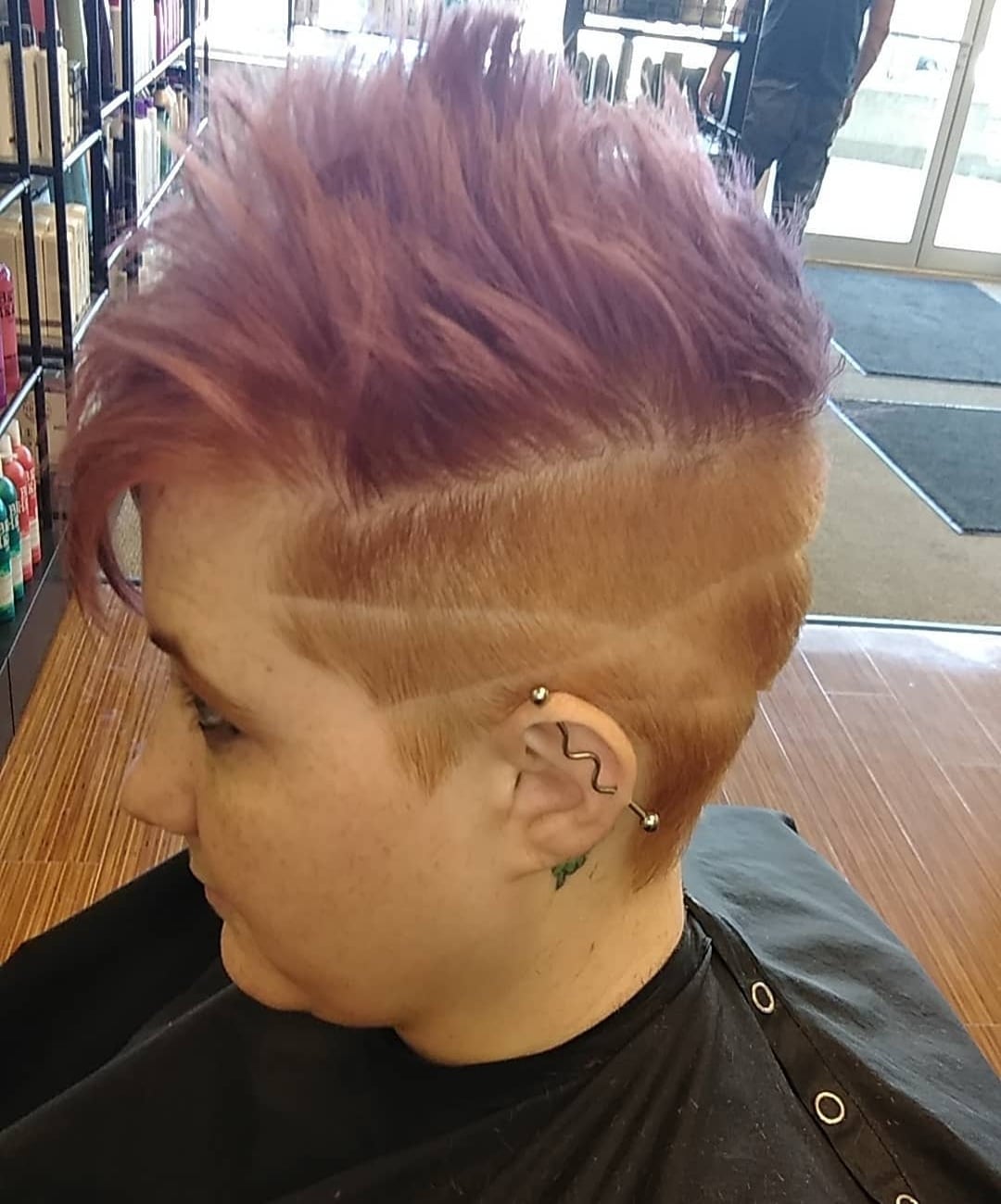 Spiky pink fohawk pixie cut with undercut line design